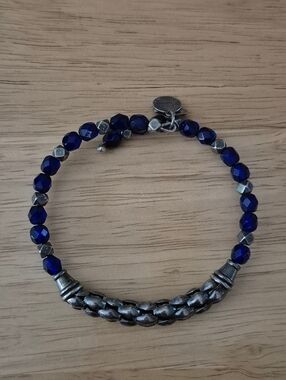 Alex and Ani Calypso Ripple Wrap Bracelet with blue beads.